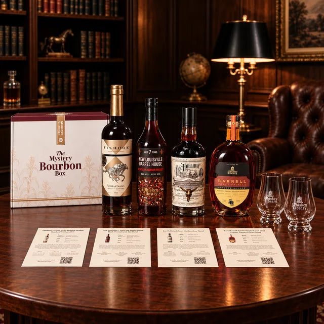 The Mystery Bourbon Box on a table with four bottles, tasting cards and two glasses